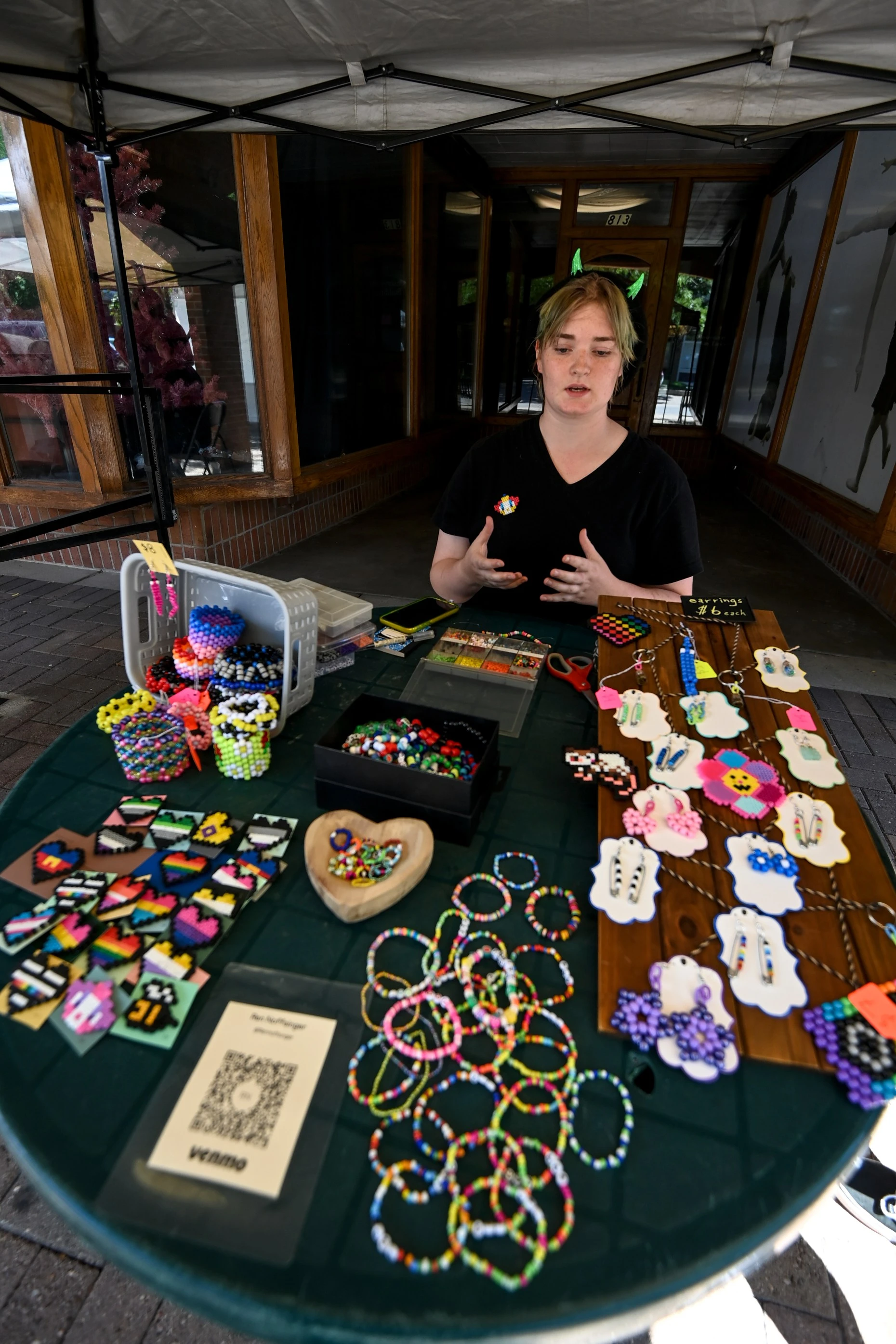 GREELEY, CO - JULY 30:Ren Noffsinger speaks to the grandstand at the 8th Street Arts Festival at 8th Street Plaza in downtown Greeley on July 30, 2022. The event, held concurrently with the Greeley Arts Picnic, makes it possible more local artists to take part in the celebrations.  (Alex McIntyre/Staff Photographer)